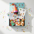 Birthday Gift Box flatlay with plush toy, party hat, stickers, badge and birthday card